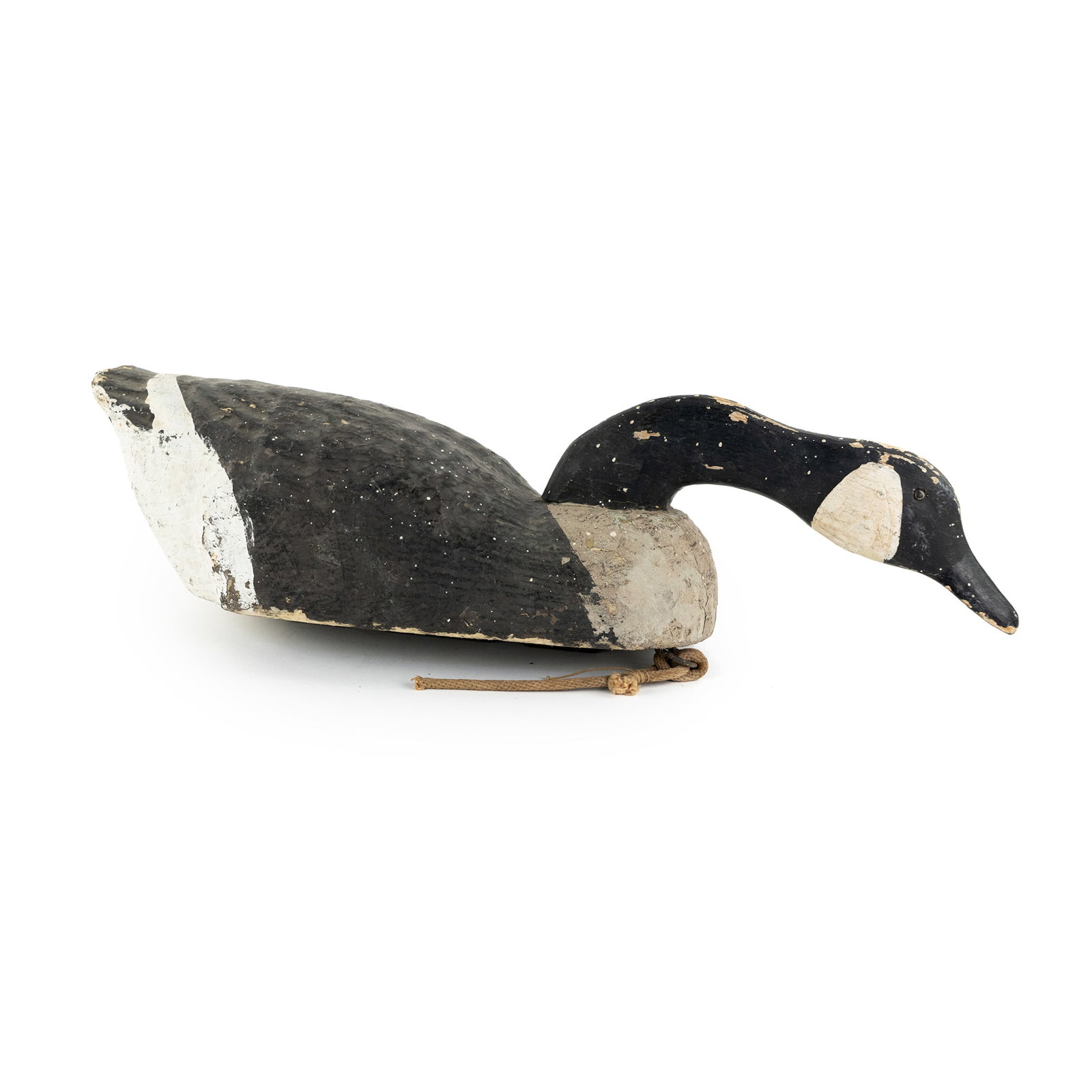 Hatteras, Dare County NC Canadian Goose Decoy: A carved Hatteras, Dare County, NC Canadian Goose decoy having a wood head and bottom painted in black, white, and gray having a metal weight on underside. Marked with '1' and 'Hatteras, NC' on unders