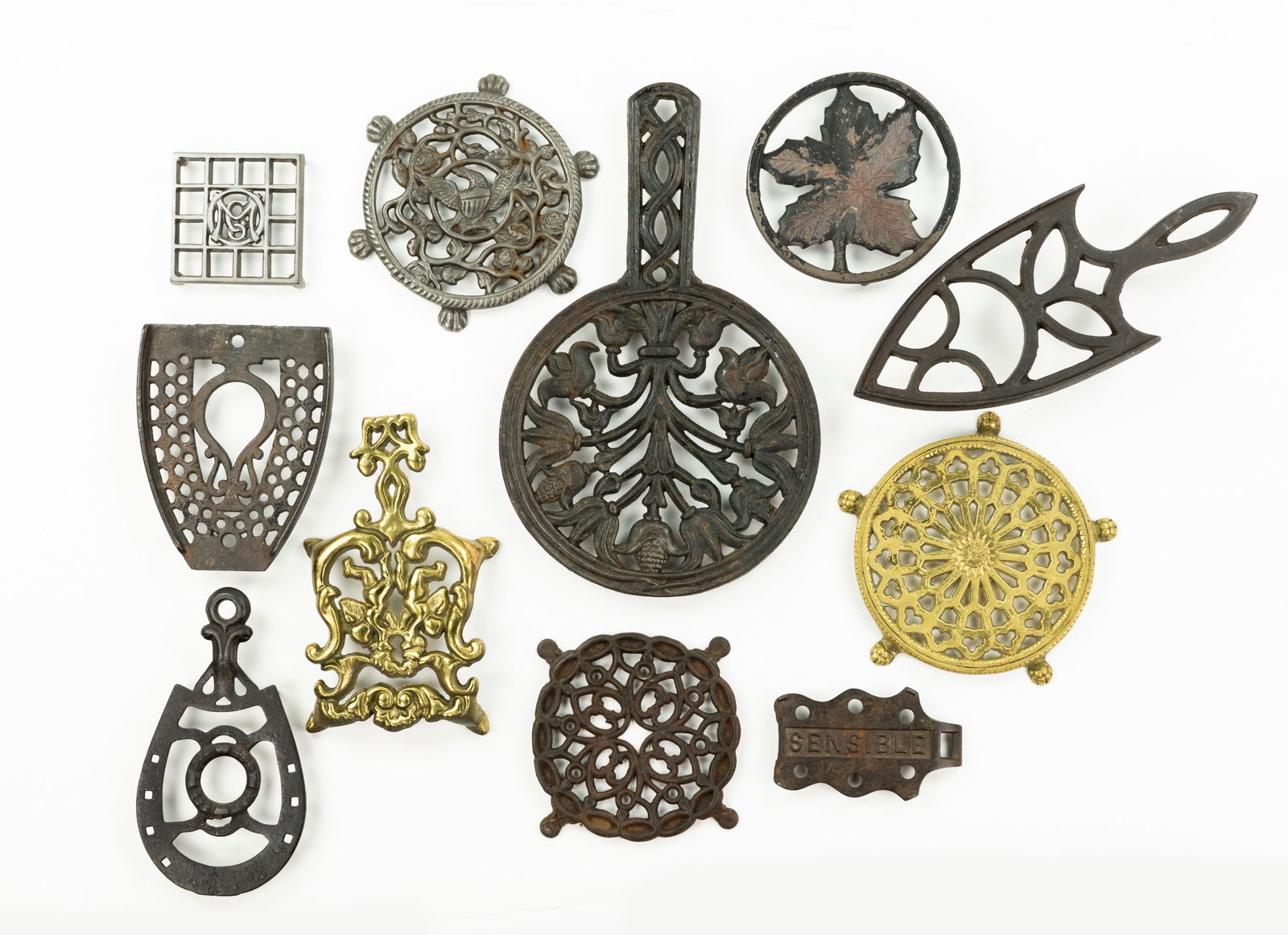 Grouping of Iron and Brass Trivets (1 of 3)