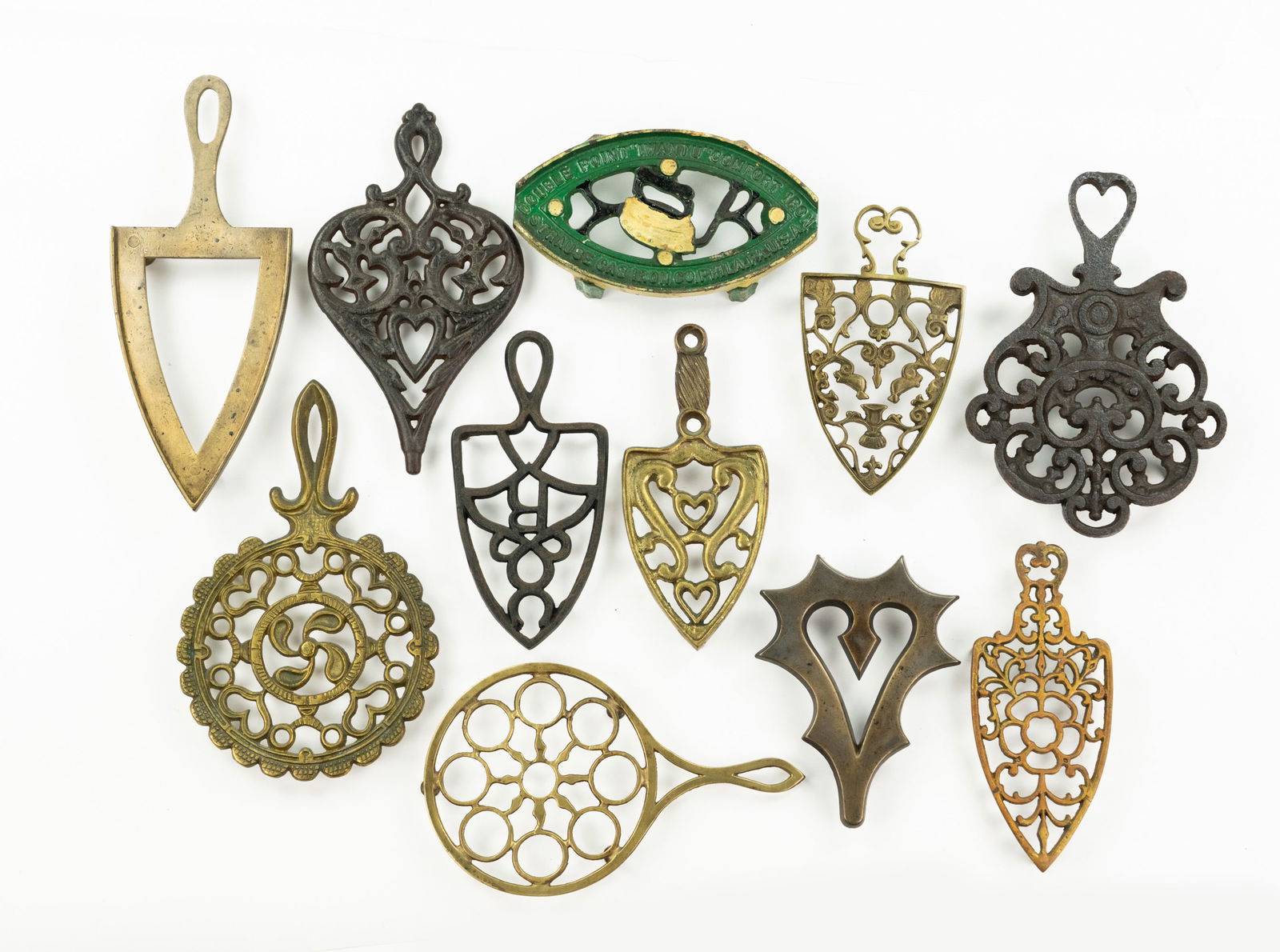 Grouping of Iron and Brass Trivets (1 of 3)