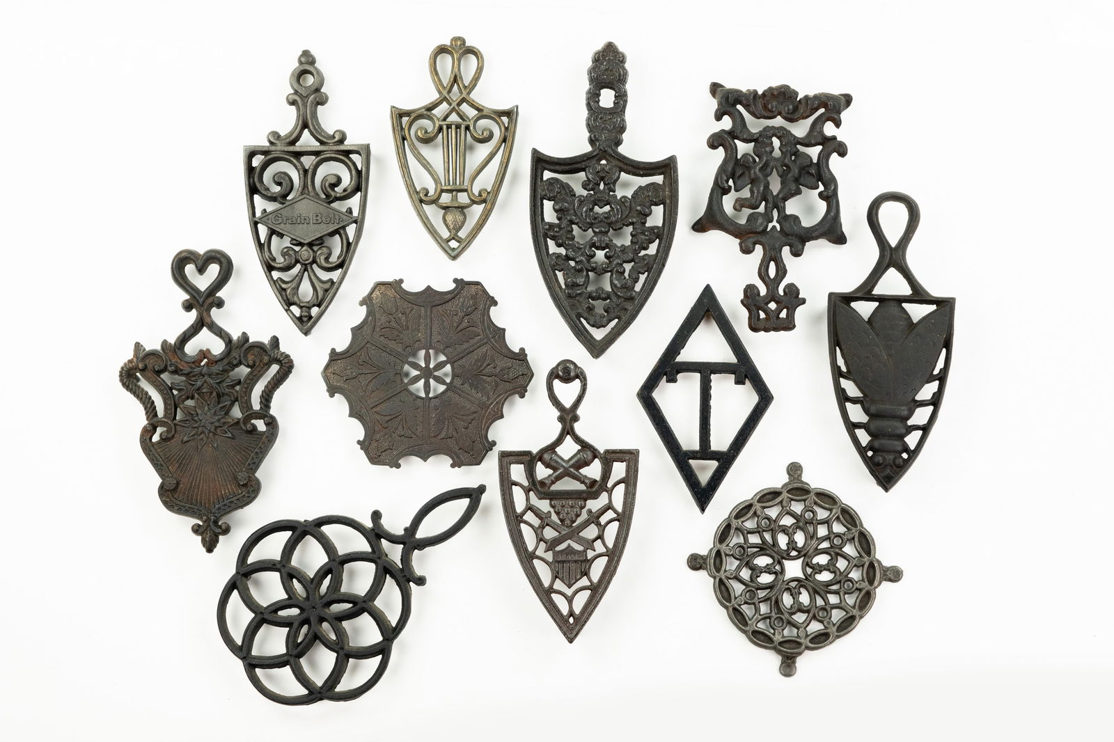 Grouping of Iron and Brass Trivets (1 of 3)