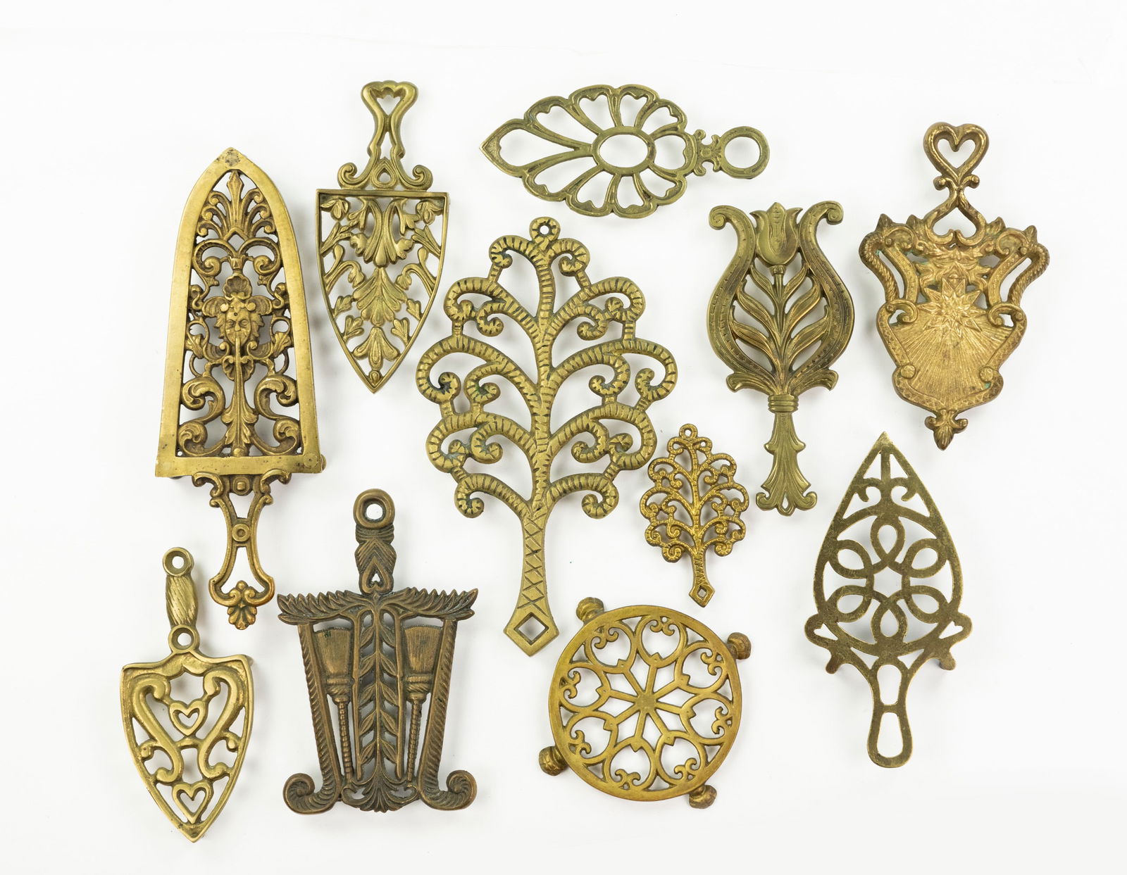 Grouping of Iron and Brass Trivets (1 of 3)