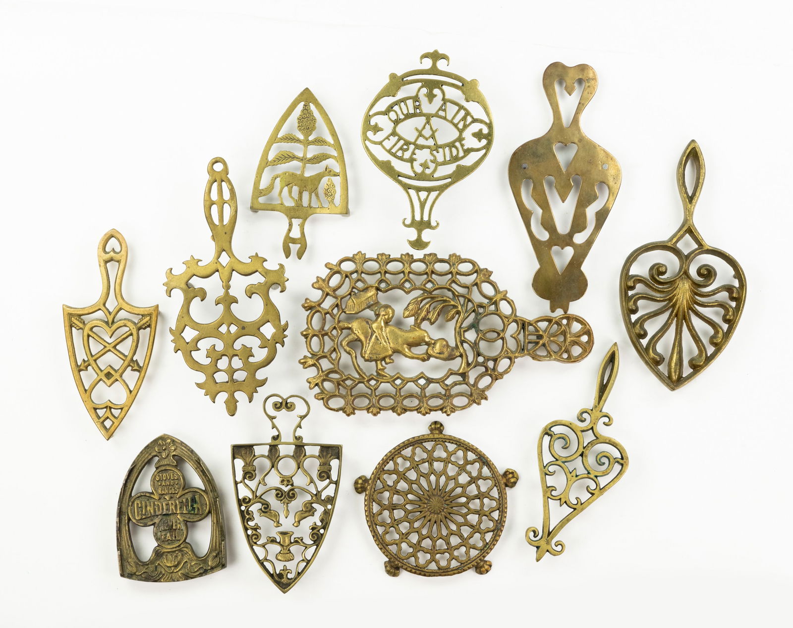 Grouping of Iron and Brass Trivets (1 of 3)