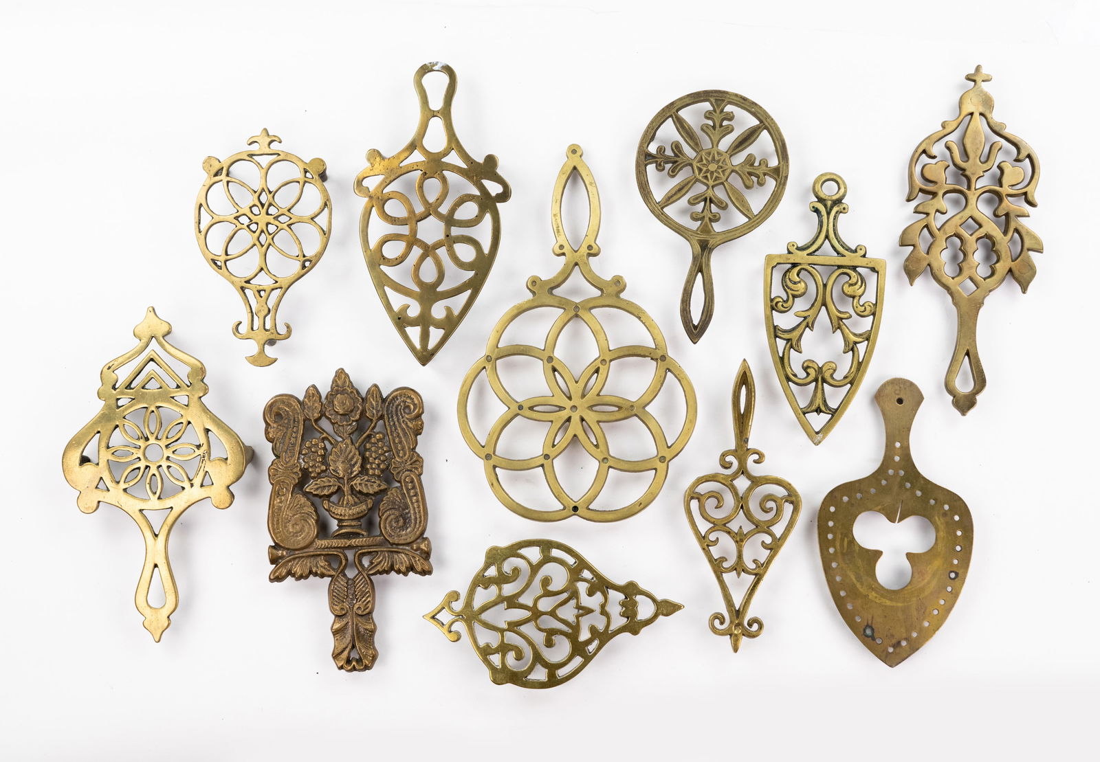 Grouping of Iron and Brass Trivets (1 of 3)