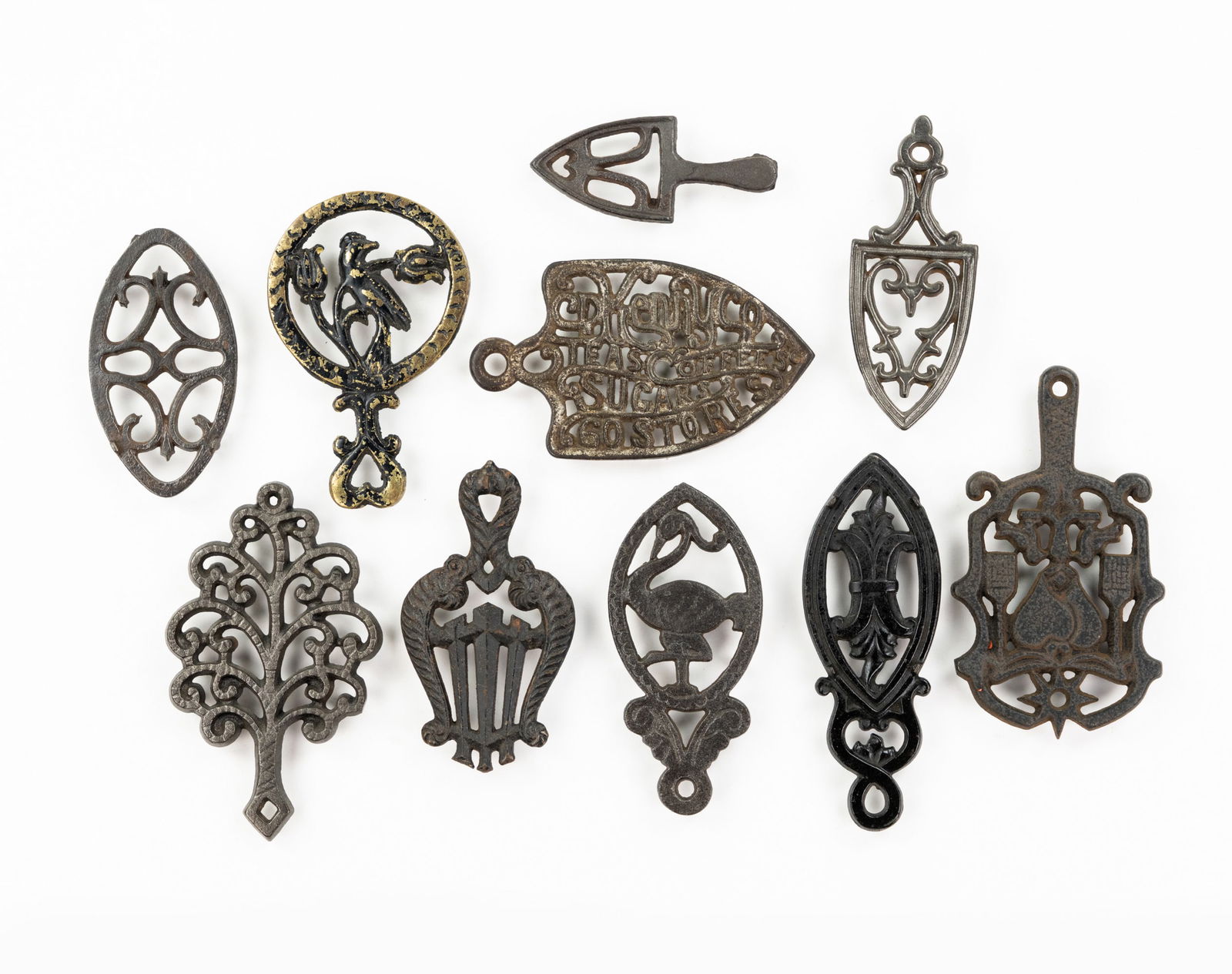 Grouping of Iron and Brass Trivets (1 of 3)