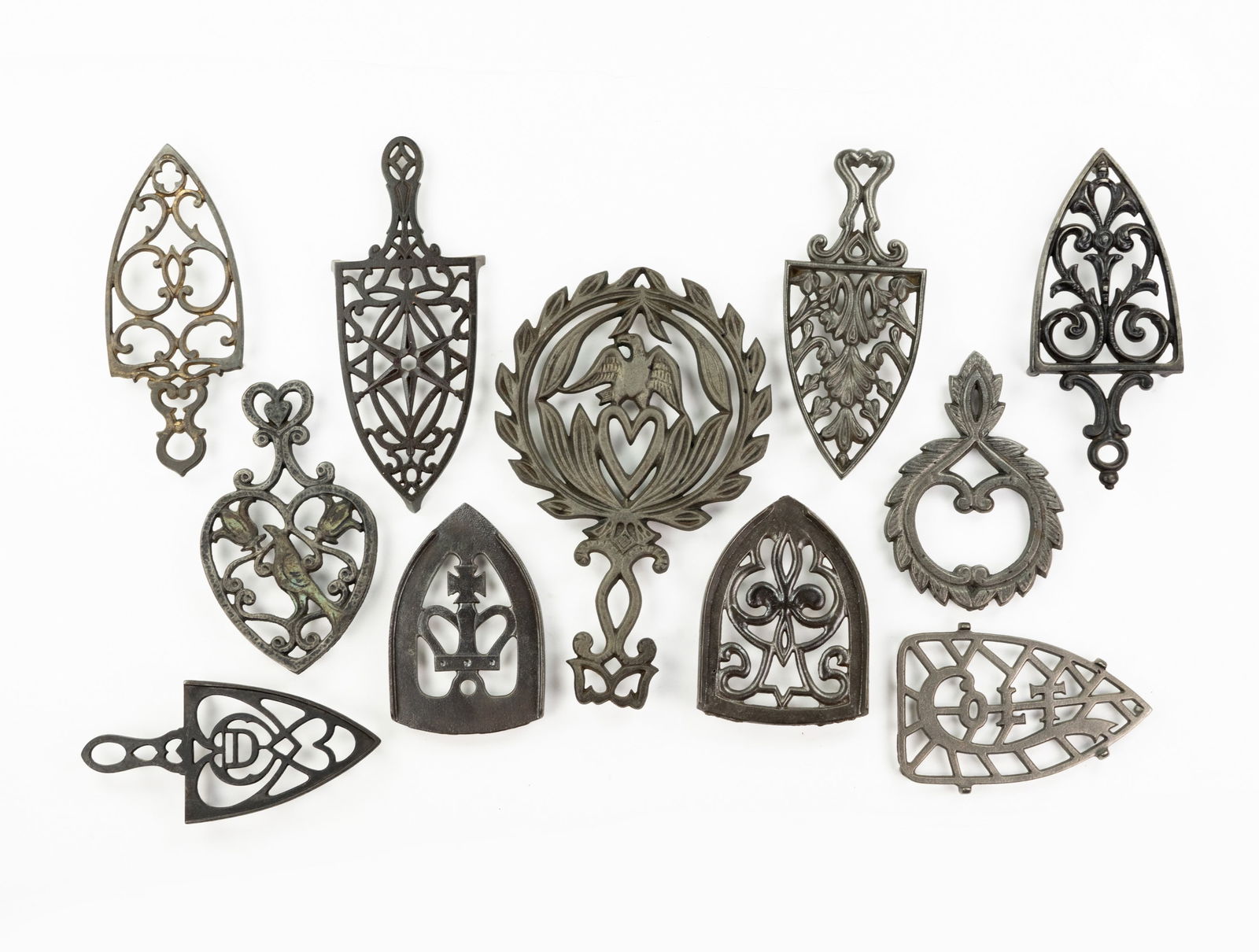 Grouping of Iron and Brass Trivets (1 of 5)