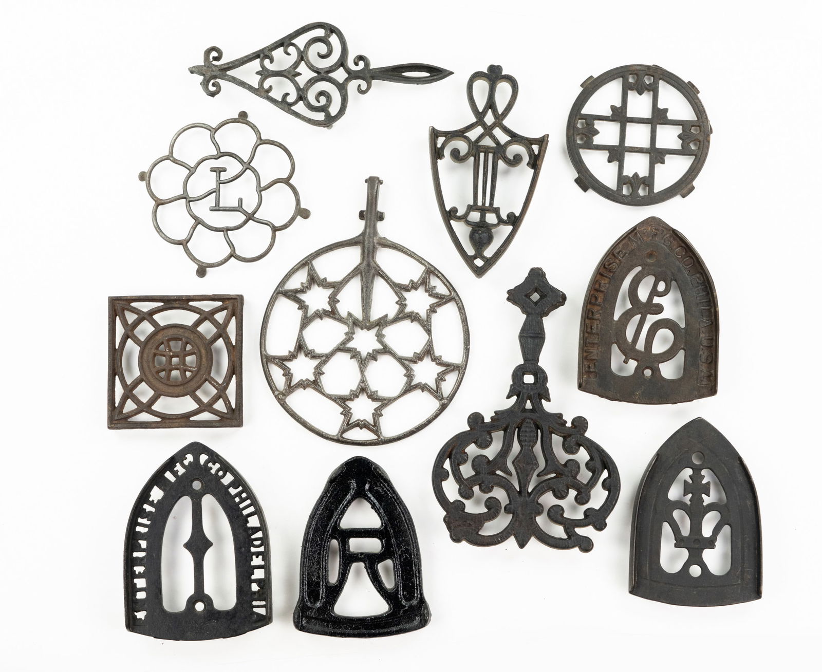 Grouping of Iron and Brass Trivets (1 of 3)