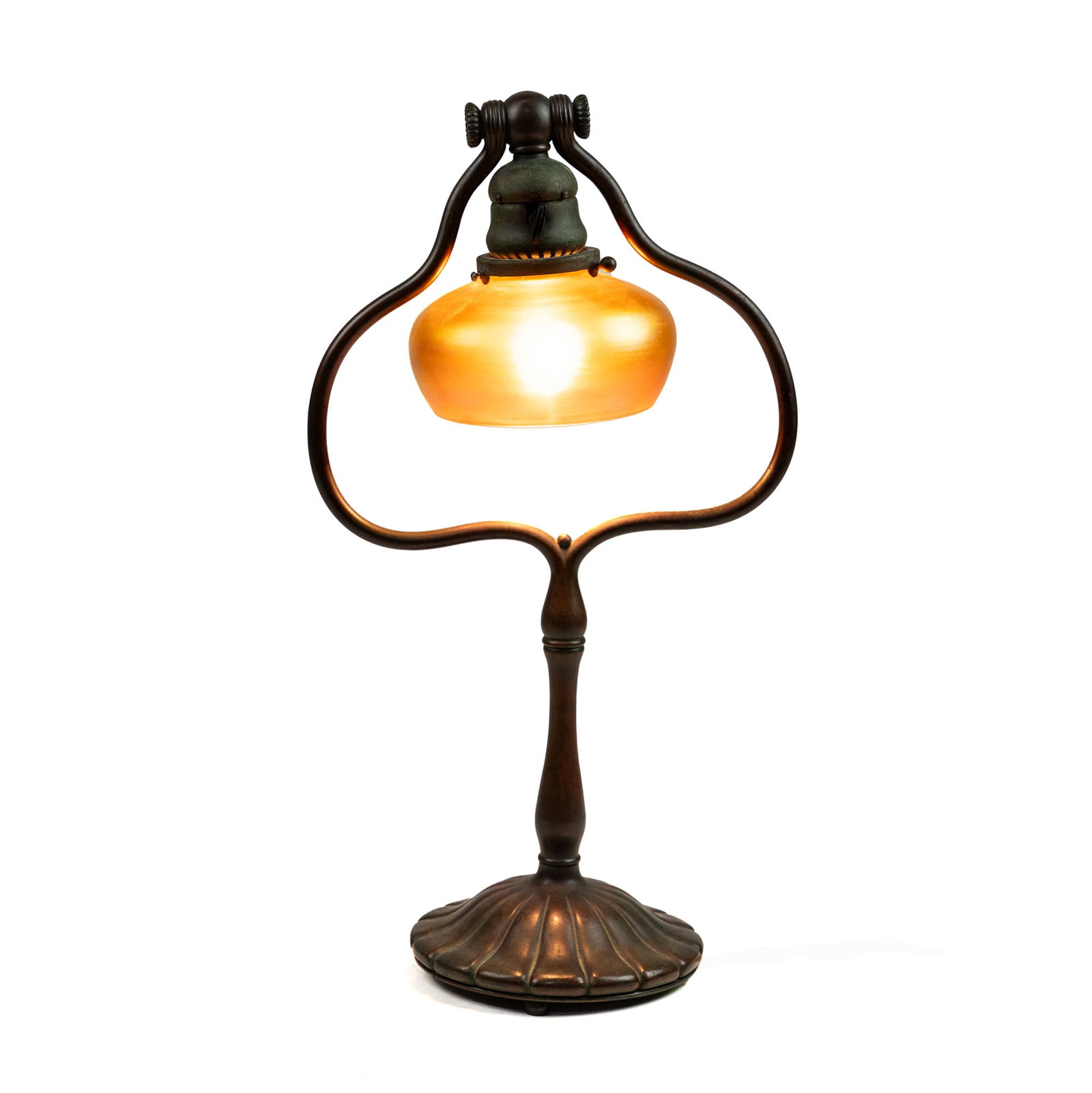 Tiffany Studios Bronze Lamp #424 & Favrile Glass Shade: A Tiffany Studios of New York bronze rotating harp table lamp and featuring a gold tone favrile Tiffany lampshade. Stamped 'Tiffany Studios New York' and '424' on the underside of the lamp base. Shade