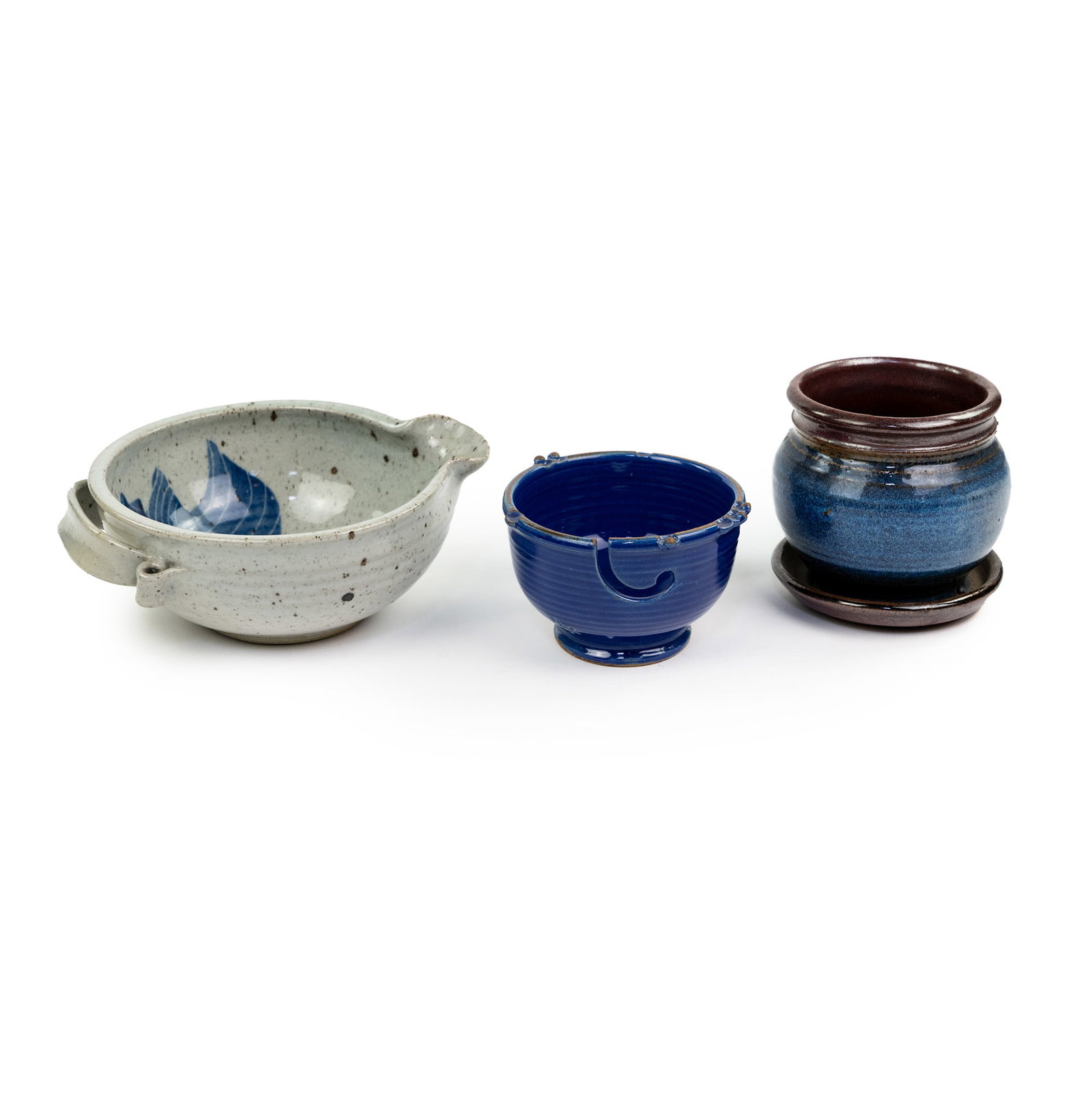 (3) Stoneware Pottery incl Paul Anthony Bowl: A group of three (3) pieces of stoneware art pottery including a Paul Anthony blue glazed yarn bowl marked at base, a salt glazed blue and gray bowl with spout and ribbon shaped handle marked illegibl