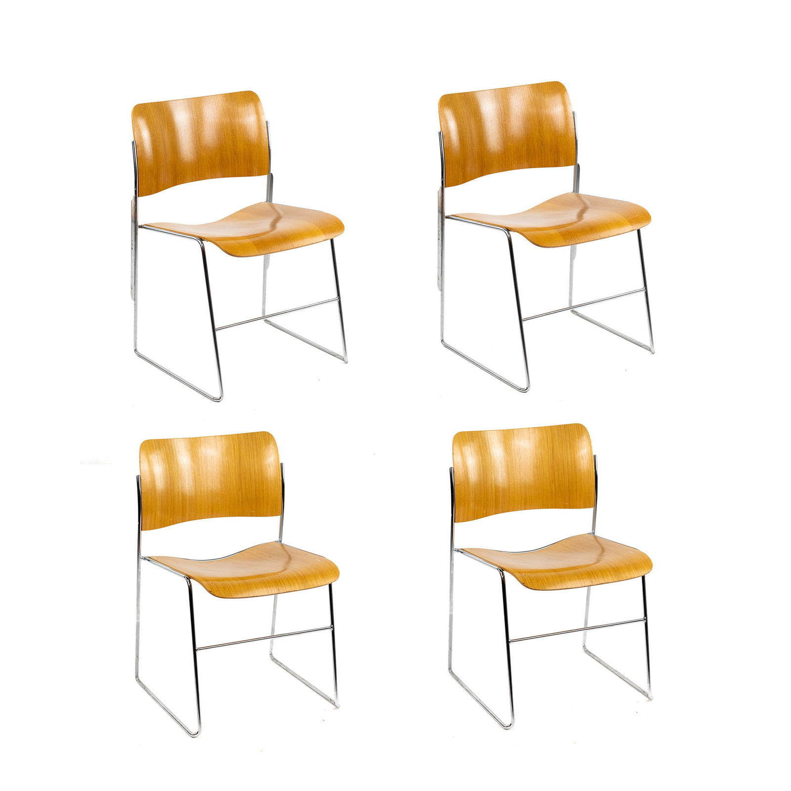 (4) Four David Rowland 40/4 Stacking Side Chairs: A set of (4) four David Rowland 40/4 stacking side chairs having a wood veneer seat and back on a chrome steel metal frame. Original labels on underside. Seat height: 16"