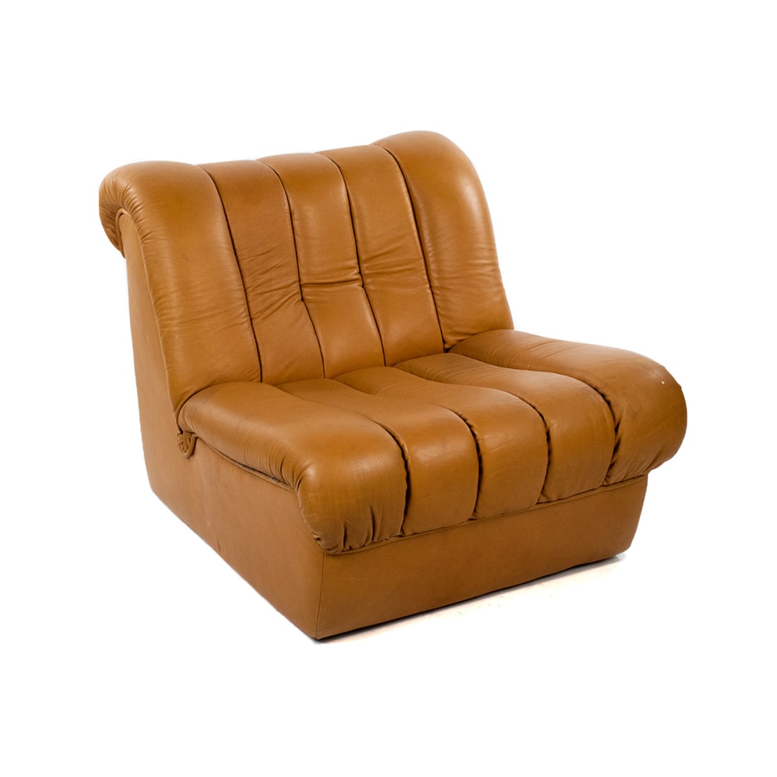 De Sede Switzerland DS 85 Cognac Leather Lounge Chair: A 1960's deSede Switzerland DS 85 modern lounge chair having pleated seat and back. Original label applied on underside.