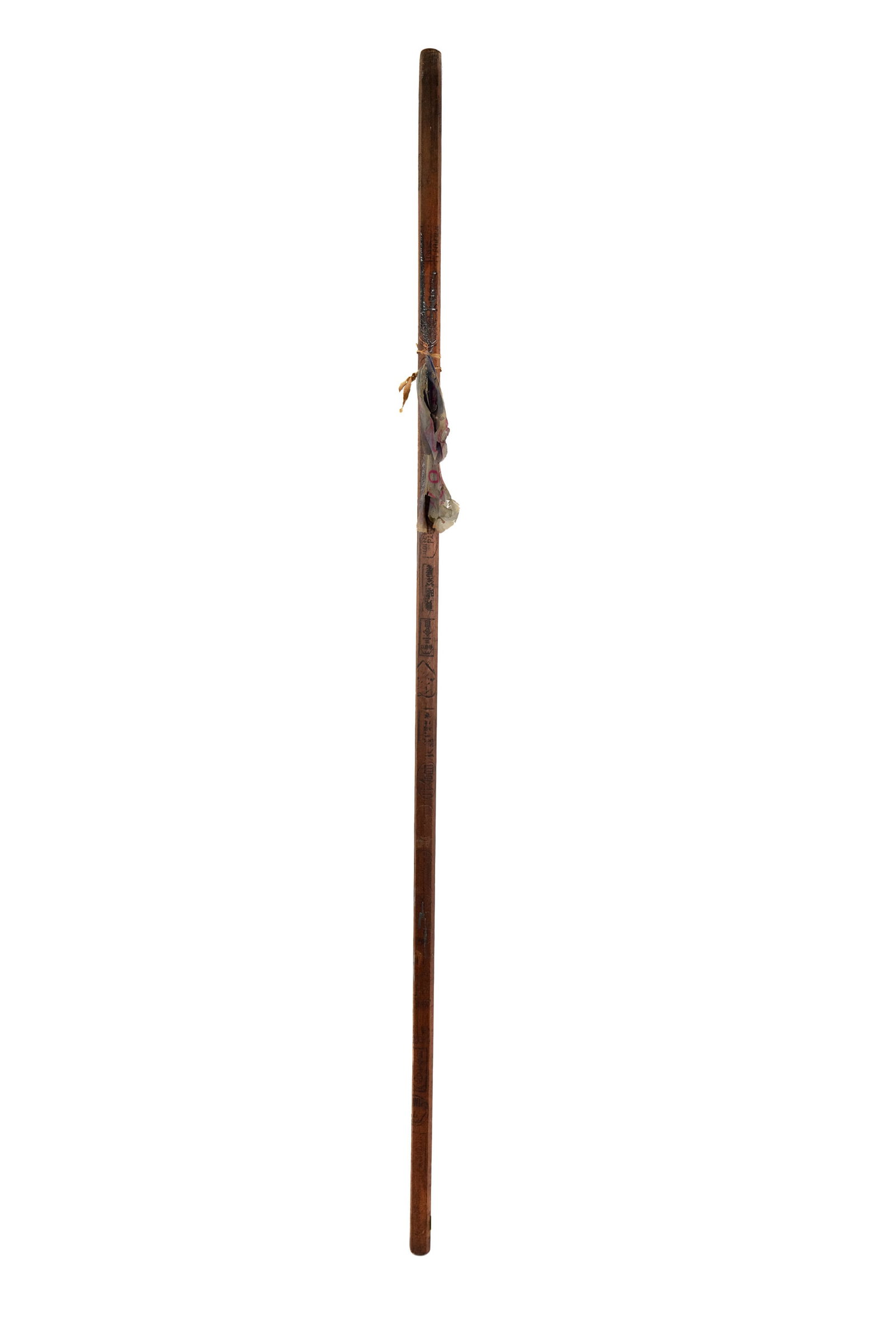 Japanese Mt Fuji Hiking Stick: A vintage Japanese Mt Fuji carved wood hiking stick or staff having carved place names or milestone including Yoshidaguchi and elevations reached and a tattered flag attached.