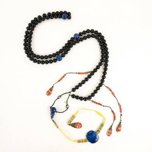 Chinese Qing Dynasty Chaozhu or Court Necklace: A Chinese Qing dynasty Chaozhu or court necklace having Peking black glass beads, lapis lazuli, coral stones and pendant with woven silk.