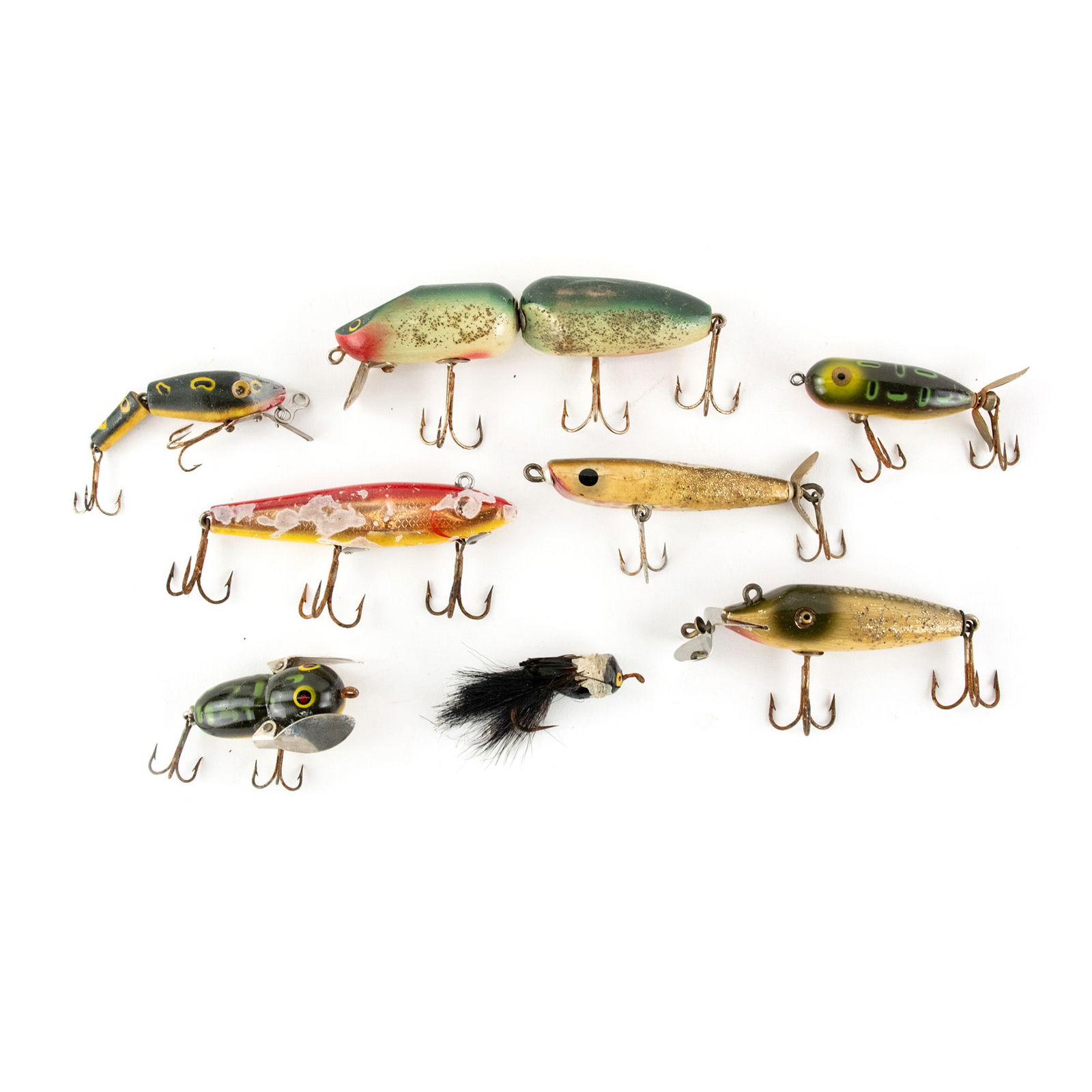 (8) Assorted Antique Fishing Lures: A group of eight (8) antique fishing lures with a Wynne Precision Ol' Skipper Jointed lure, C.C.B. Co. Baby Pikie Minnow, Heddon Tiny Crazy Crawler, Heddon Tiny Torpedo, L&S 52M28, L&S Panfish Sinker,