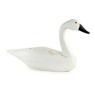 1983 Hand Carved L.D Scarborough Tundra Swan Wood Decoy: A 1983 L.D Scarborough hand carved Tundra Swan wood decoy painted white, black, and yellow with red and black eyes. Signed, dated, and marked Duck N.C on underside.