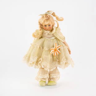 1930's Lenci Italian 300 Series Miniature Felt Doll: A circa 1930's Lenci Italian 300 series miniature young girl doll made of felt and cloth wearing a pale yellow dress with large orange flower in center and having two braids in her hair. Includes