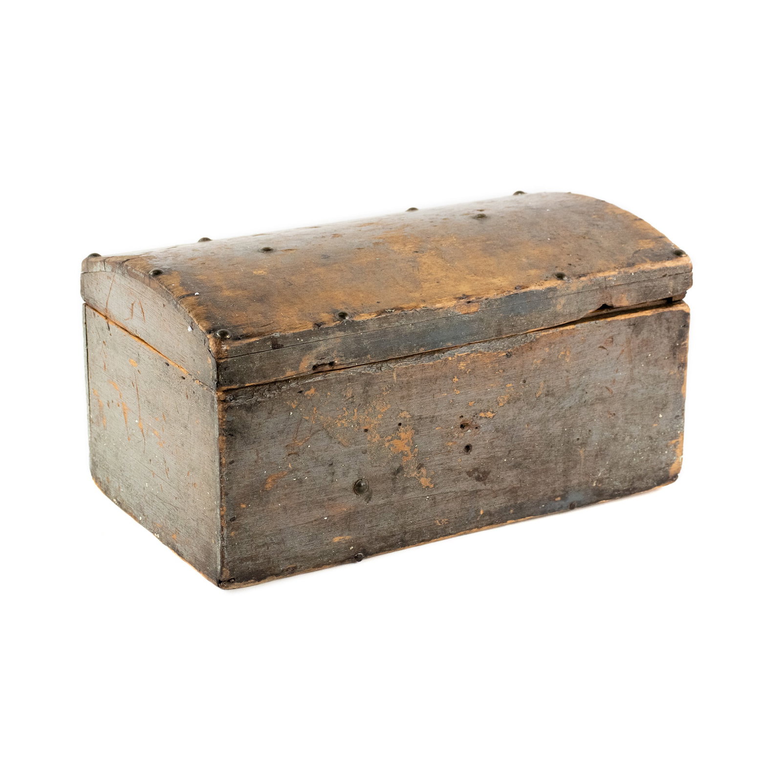Distressed Gray Painted Studded Wooden Trunk: A distressed gray painted wooden trunk having one compartment with a rounded hinged lid and featuring a simple studded trim.