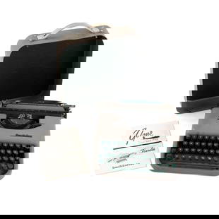 Vintage Smith-Corona Portable Skyriter Typewriter: A vintage Smith-Corona portable 'Skywriter' typewriter in grey and green with a detachable carrying cover. Includes manual.