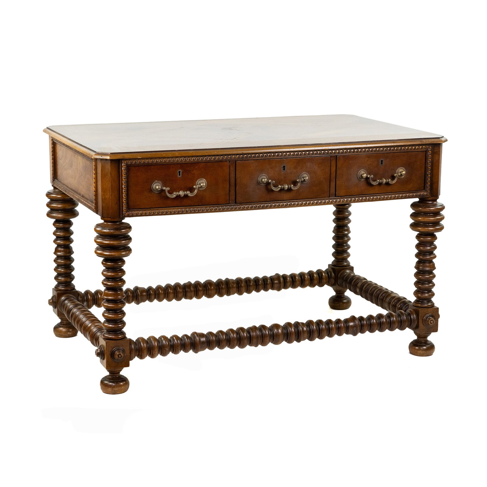 Baroque Iberian Marquetry Inlay Writing Desk: A Portuguese Baroque style walnut writing desk having a geometric design marquetry inlaid top with three drawers having brass bail pulls, and resting atop four bobbin turned legs with stretcher.