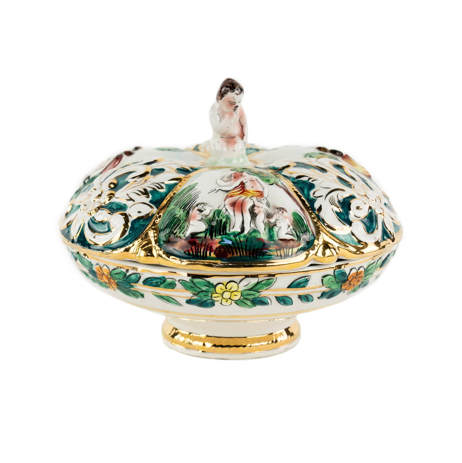 Italian Capodimonte Porcelain Lidded Footed Bowl: An Italian capodimonte porcelain bowl having a scalloped edge lid with depictions of cherub and nymphs in bas relief alongside floral motifs and a pull shaped as a cherub, and featuring handpainted fl
