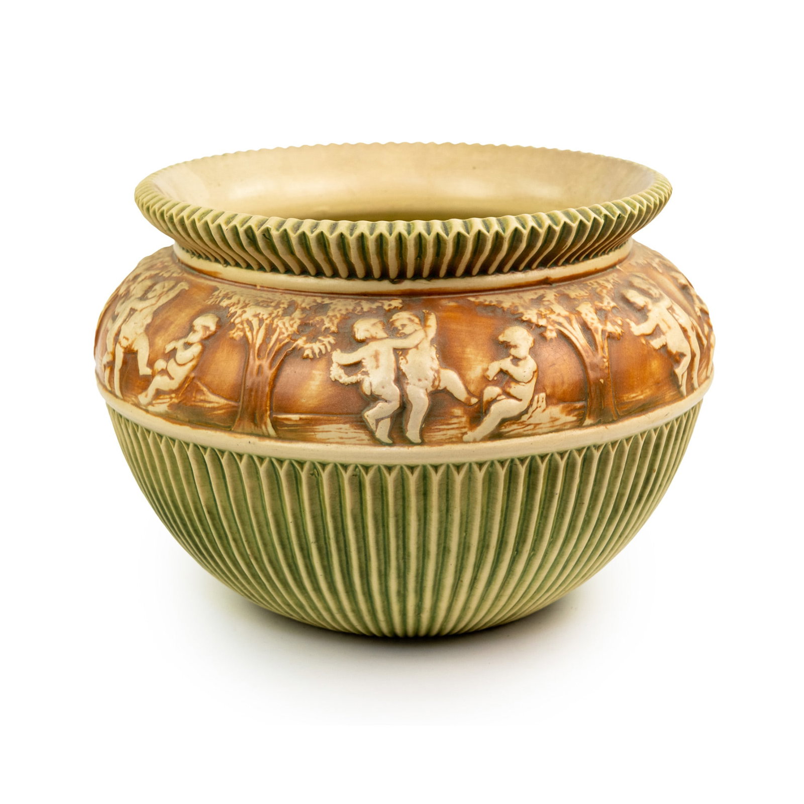 Roseville Donatello Art Pottery Jardiniere: A Roseville Donatello jardiniere featuring a relief of a group of cherubs dancing in the woods, and having a green fluted pattern. Makers mark stamped on underside.