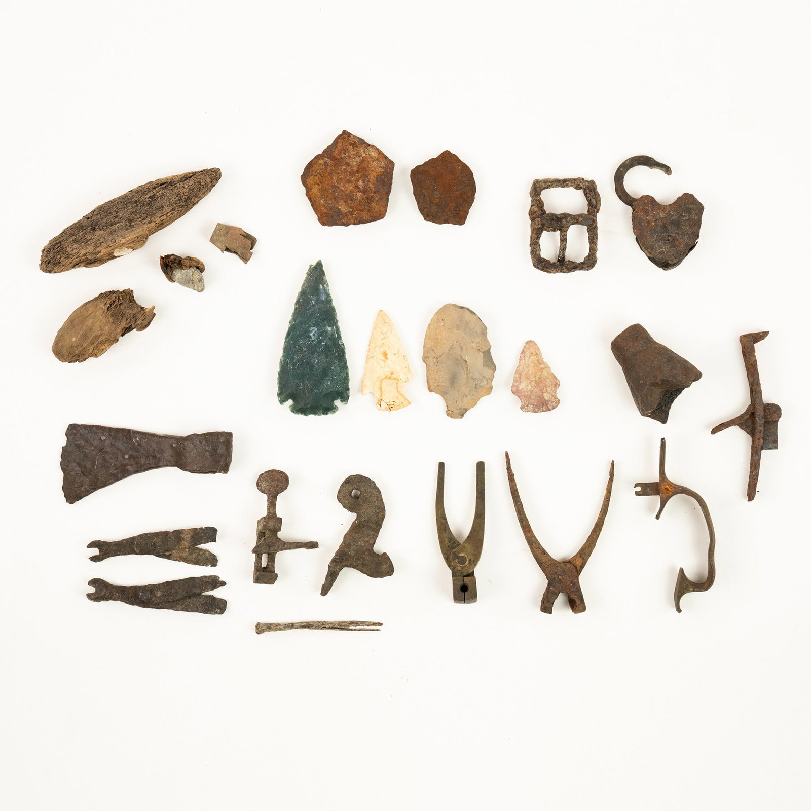 Collection of Civil War Era Relics - Mobile, AL: A collection of Civil War dug relics including a Tomahawk Shenkel remnant, spear points, bullet molds, gun tools, musket trigger guards, hammer, spring compressor, impacted bullets in wood, Recovered 
