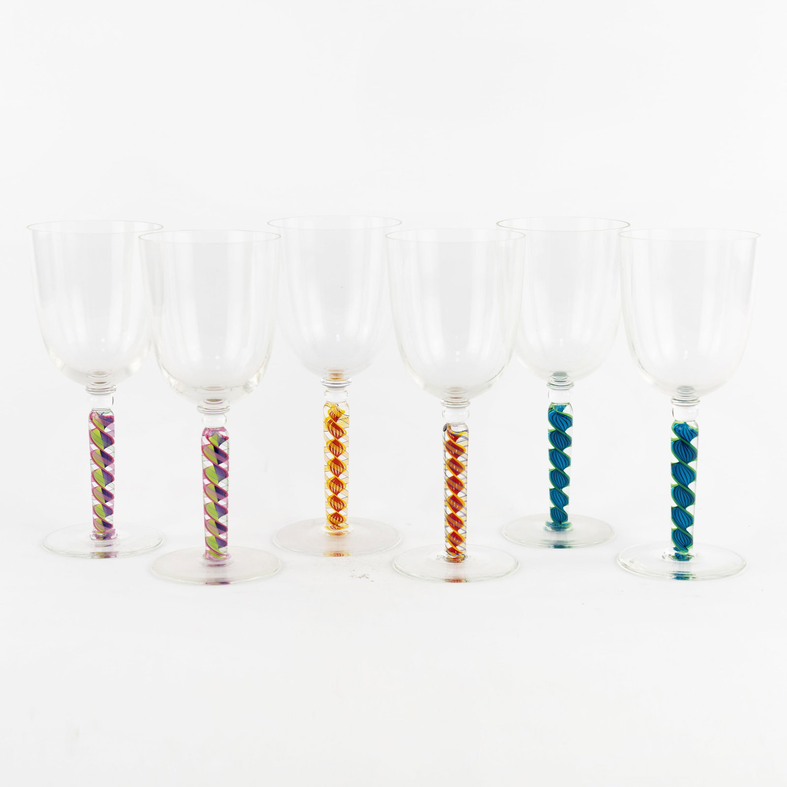 (6) Set of Nadal Art Glass Wine Glasses: Artist Name: James Nadal Studio: Nadal Glass Location: Canandaigua, New York Medium: Studio art glass Description: A set of (6) hand blown art glass wine glasses with spiral motif stems. Each incised