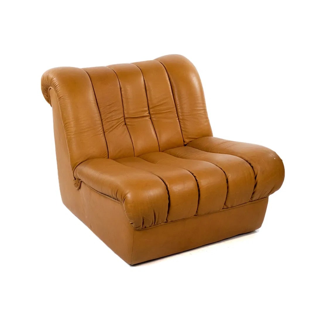 De Sede Switzerland DS 85 Cognac Leather Lounge Chair: A 1960's deSede Switzerland DS 85 modern lounge chair having pleated seat and back. Original label applied on underside.
