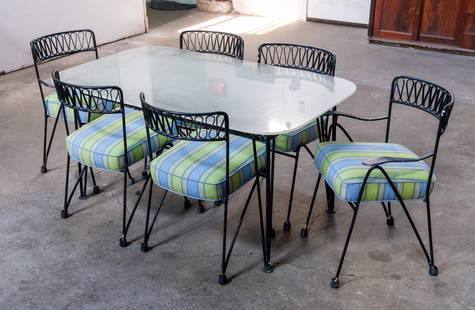 Maurizio Tempestini Wrought Iron Dining Set: A Maurizio Tempestini for Salterini wrought iron indoor/outdoor dining set including a dinign table and six (6) chairs featuring ribbon back design with blue and green striped upholstery. The table di