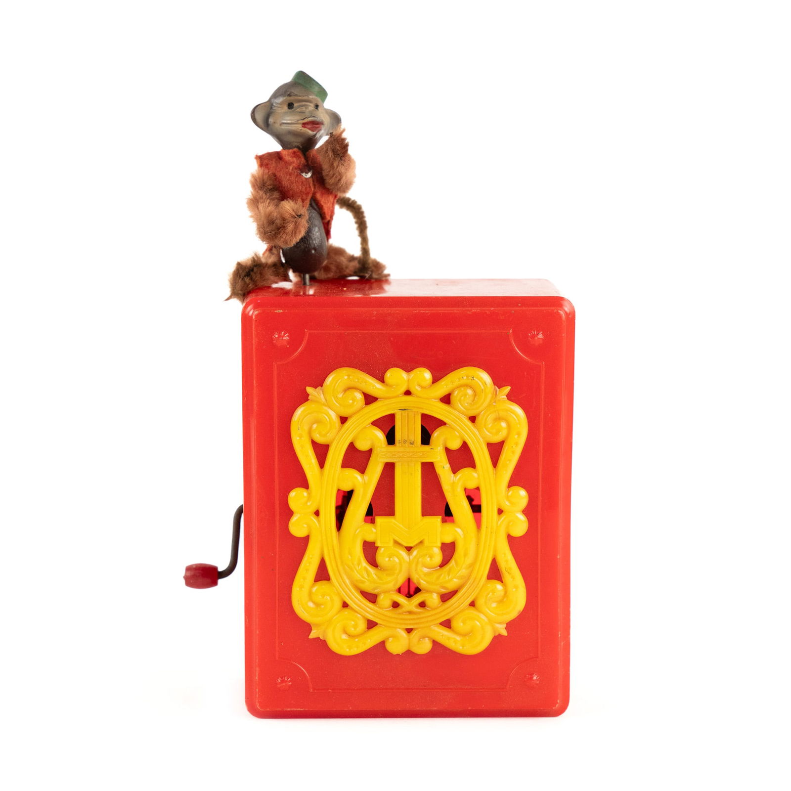 Futurland Toy for Mattel Organ Grinder Toy with Monkey: A Futurland Toy for Mattel organ grinder or hurdy gurdy plastic toy in red and yellow having a monkey model attached to the top. Stamped on verso.