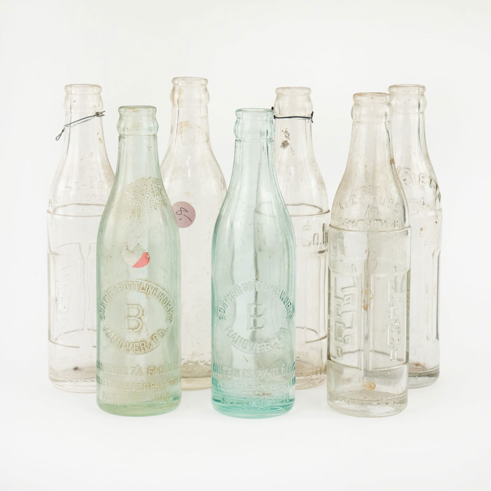 (7) Group of Antique  Assorted Embossed Glass Bottles (1 of 9)