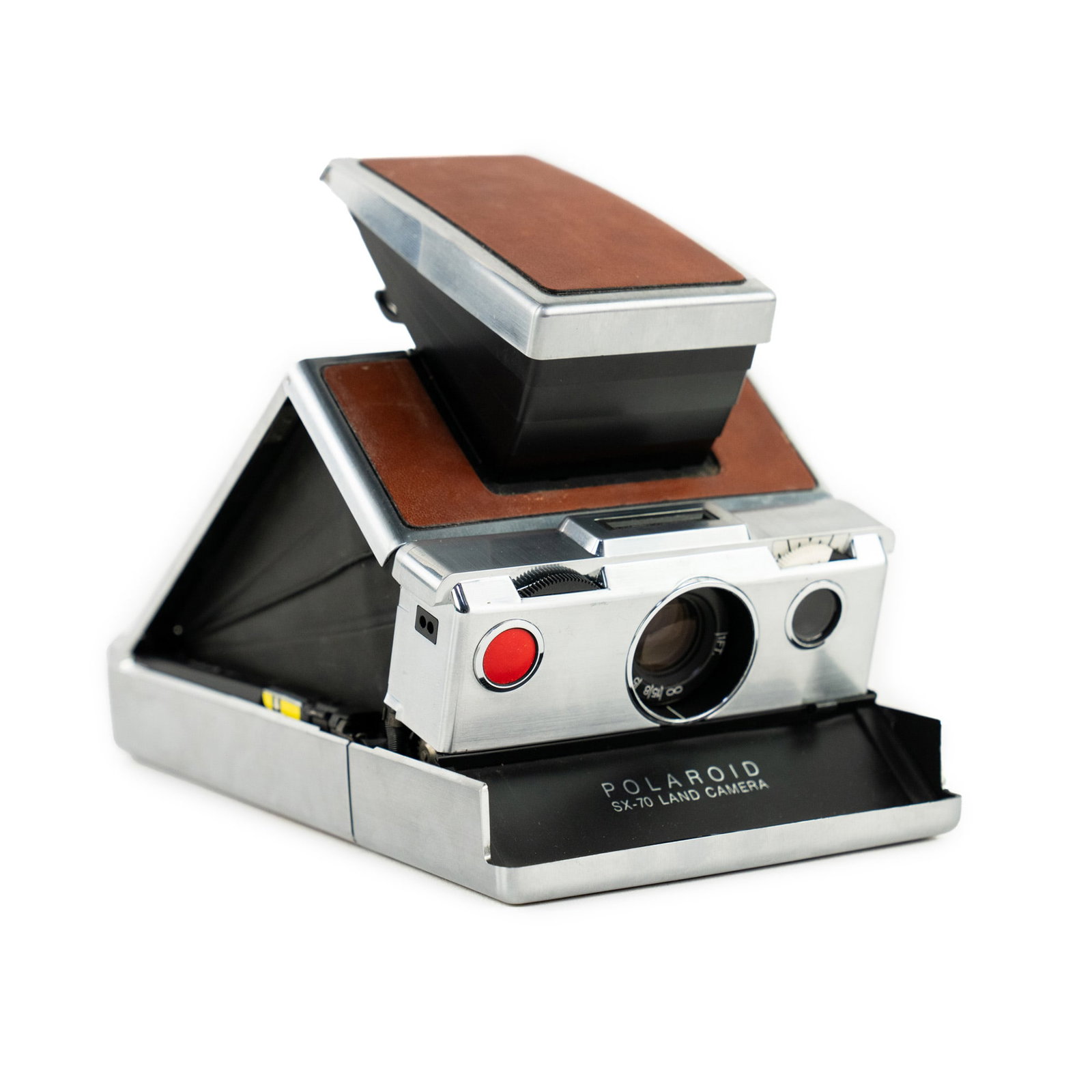 Polaroid SX-70 Land Camera: A Polaroid SX-70 Land Camera having a foldable chrome and leather body. Measurements are for when item is closed.