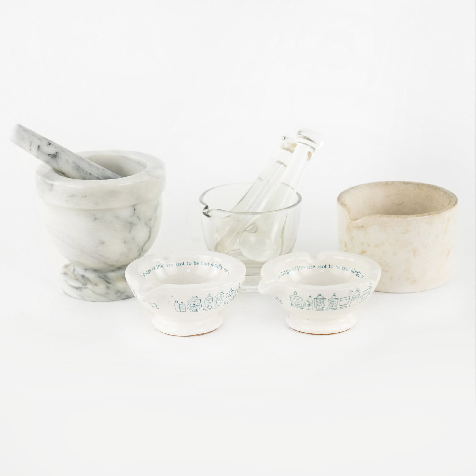 (5) Group of Assorted Pestles and Mortars inc. Cooper: A group of (5) assorted pestle and mortars including: two mortars by Merck, Sharp and Dohme; a cylindrical mortar by Cooper; a white & black marble mortar and pestle, and a glass mortar with three gla