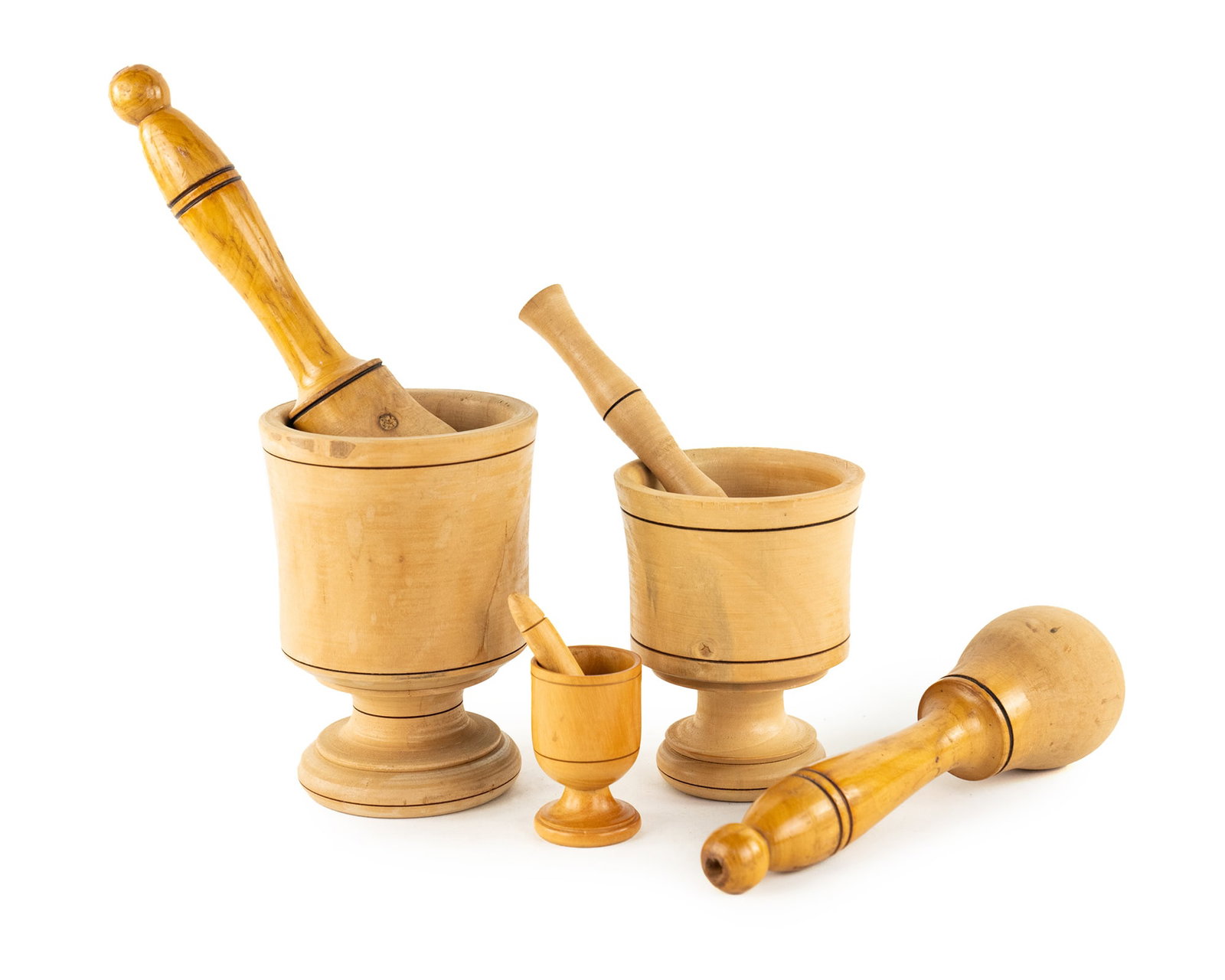 (3) Group of Wooden Pestles and Mortars: A group of (3) wooden mortars and pestles each decorated with a simple stripe motif. Measurements are for largest.