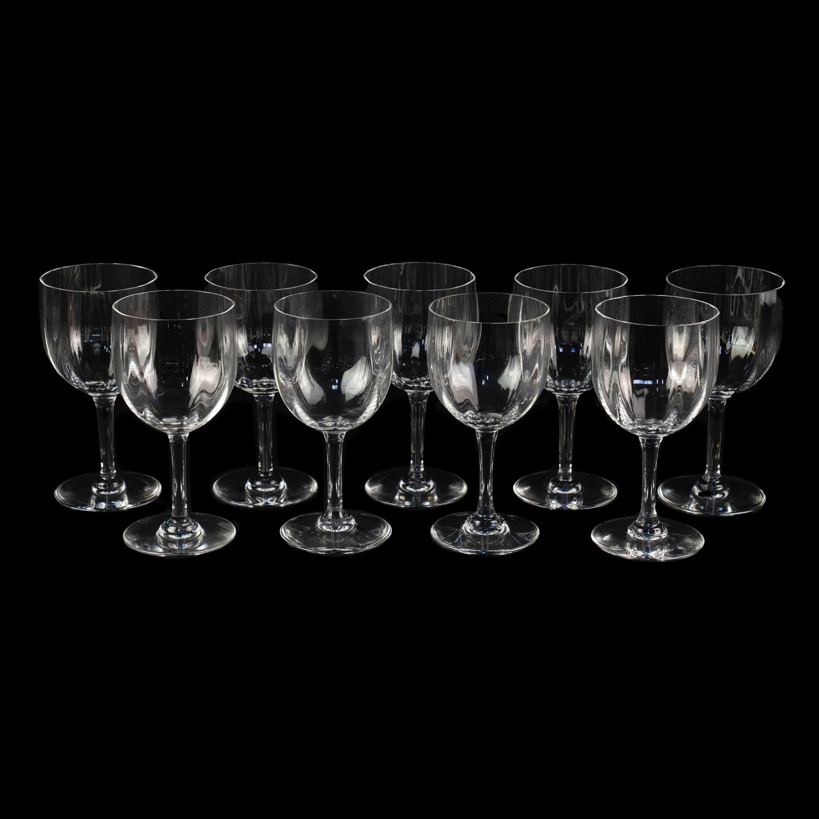 (9) Set of Baccarat Montaigne Claret Wine Glasses: A set of (9) Baccarat Montaigne (Optic) crystal Claret wine glasses. Stamped on underside.