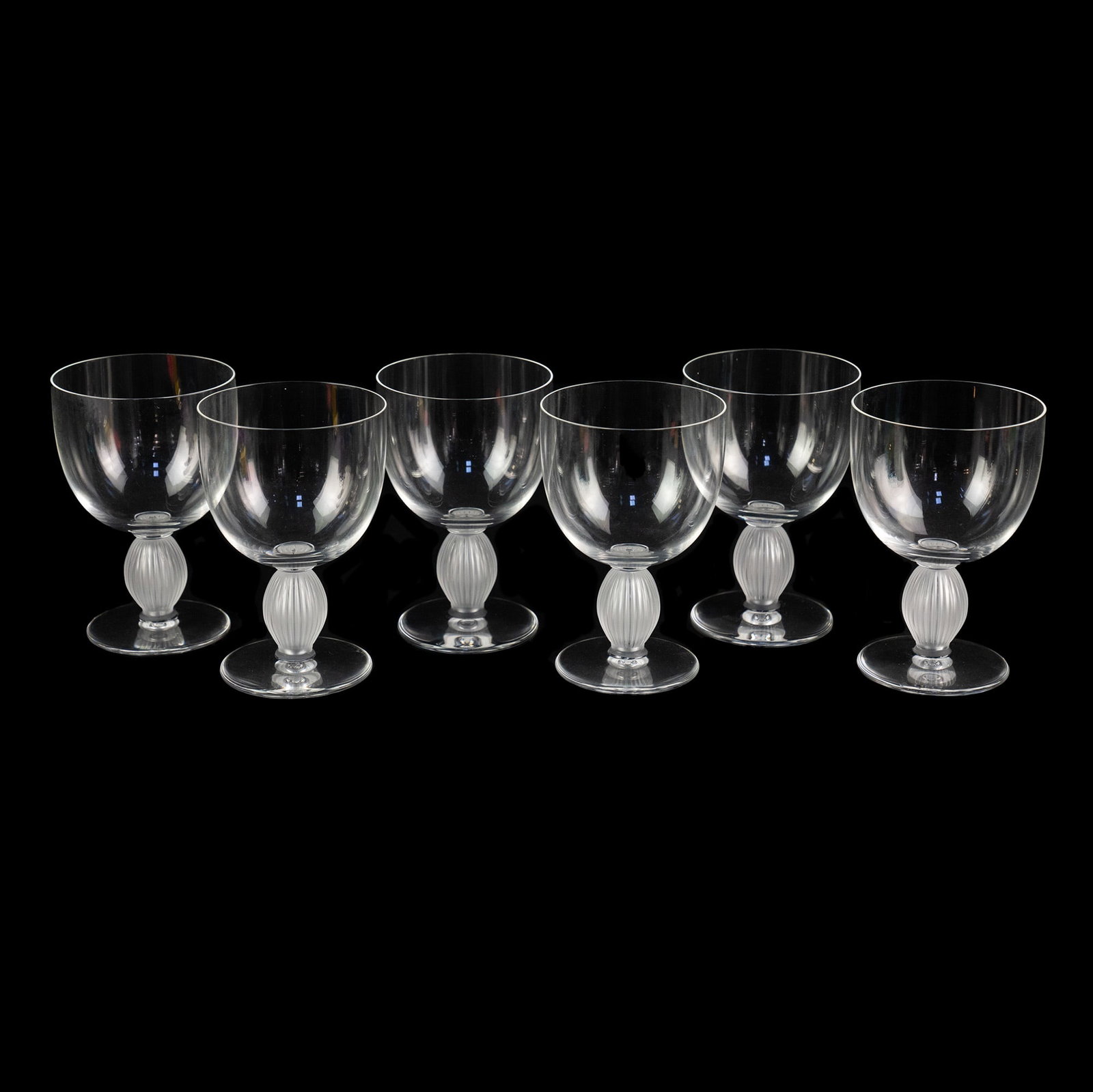 (6) Lalique Langeais Burgundy Wine Glasses: A set of (6) Lalique Langeais crystal Burgundy wine glasses having frosted and fluted stems. Incised marked on underside.