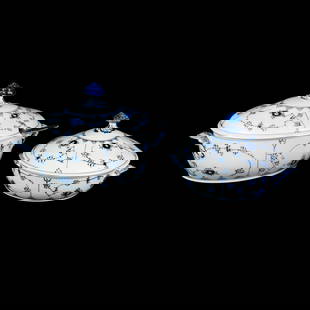 Pair of Royal Copenhagen Blue Fluted Porcelain Dishes: A pair of Royal Copenhagen of Denmark Blue Fluted covered dishes each having fluted edges and mushroom motif lid handles. Each featuring blue floral motifs throughout. Each stamped and editioned on un