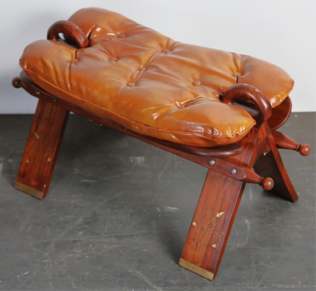 ROSEWOOD BRASS INLAID TUFTED CAMEL SEAT: Rosewood brass inlaid tufted camel seat. Note: Each lot in this auction was stored in an active industrial warehouse. Accordingly, lots may exhibit dust and/or surface residue and may benefit from cle