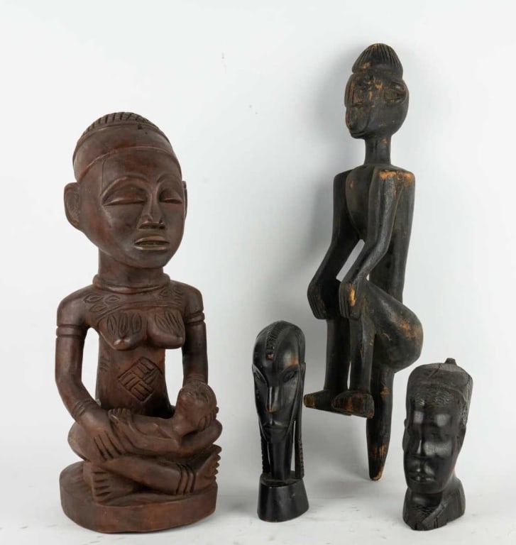 AFRICAN GROUPING OF 4 CARVED WOOD SCULPTURES: Grouping of 4 carved wood African sculptures. Note: Each lot in this auction was stored in an active industrial warehouse. Accordingly, lots may exhibit dust and/or surface residue and may benefit fro