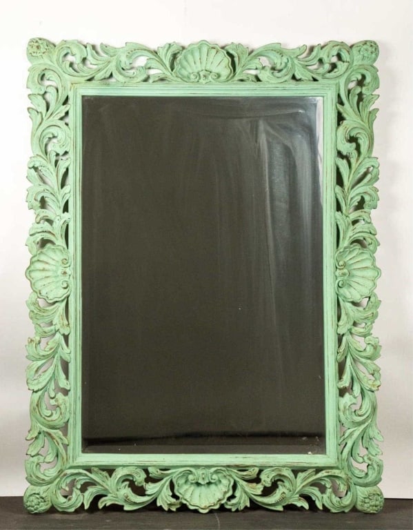 FRENCH CARVED MAHOGANY VERDIGRIS BEVELED MIRROR: Hand carved mahogany verdigris beveled mirror. Note: Each lot in this auction was stored in an active industrial warehouse. Accordingly, lots may exhibit dust and/or surface residue and may benefit fr