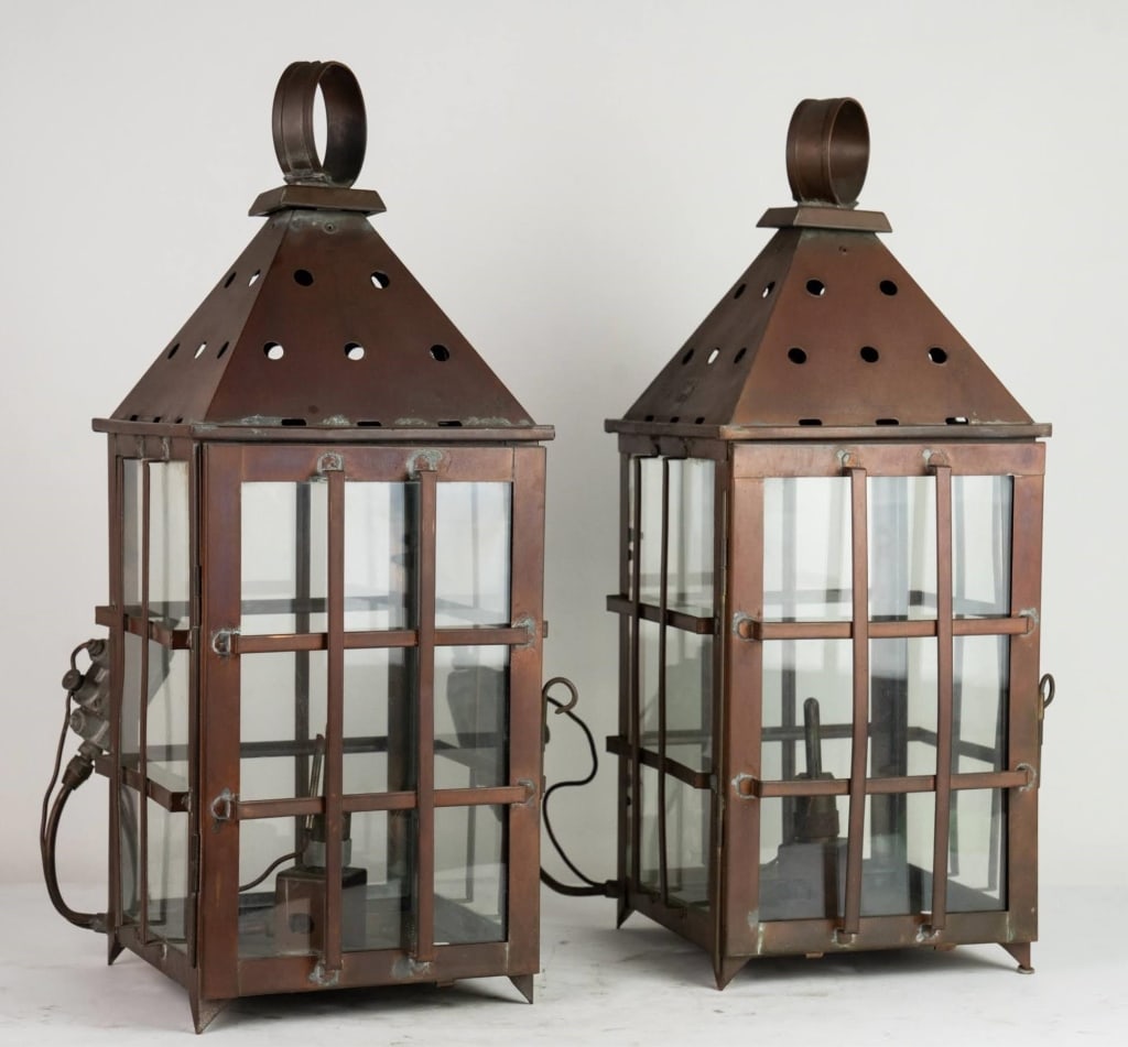AMERICAN PAIR OF COPPER AND GLASS LANTERNS: Pair of copper and glass lanterns. Note: Each lot in this auction was stored in an active industrial warehouse. Accordingly, lots may exhibit dust and/or surface residue and may benefit from cleaning.