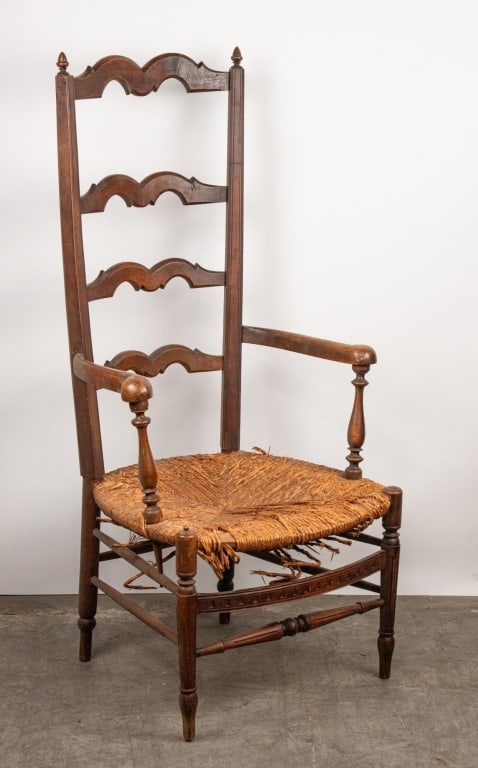 ANTIQUE LADDERBACK RUSH SEAT CHAIR: Antique ladderback rush seat chair. Note: Each lot in this auction was stored in an active industrial warehouse. Accordingly, lots may exhibit dust and/or surface residue and may benefit from cleaning