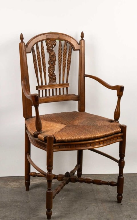 FRENCH PROVINCIAL STYLE CARVED ARMCHAIR: French provincial style carved armchair. Note: Each lot in this auction was stored in an active industrial warehouse. Accordingly, lots may exhibit dust and/or surface residue and may benefit from cle