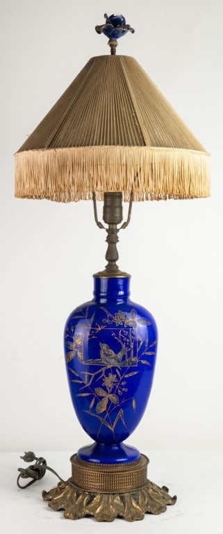 EUROPEAN BLUE AND GILT VASE LAMP WITH SHADE: European blue and gilt vase porcelain lamp with shade. Note: Each lot in this auction was stored in an active industrial warehouse. Accordingly, lots may exhibit dust and/or surface residue and may be