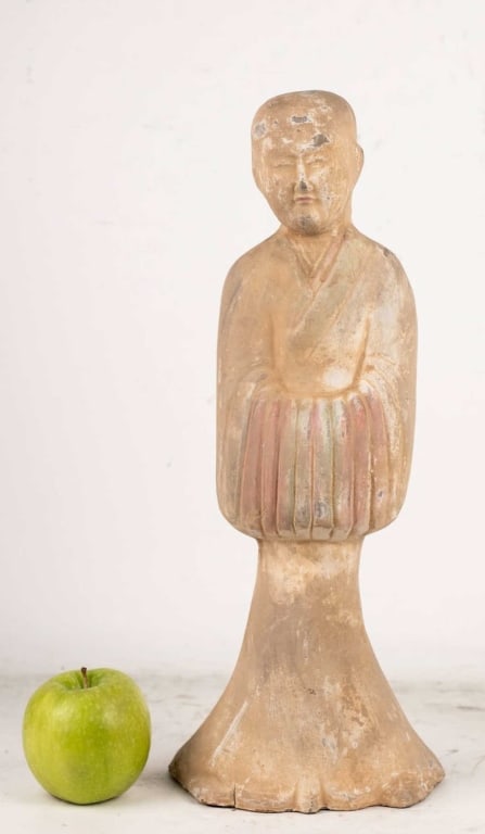 CHINESE TERRACOTTA FIGURE WITH FOLDED HANDS: Asian terracotta sculpture molded earthenware figure robed with hands tucked in sleeves; flaring integral base. Note: Each lot in this auction was stored in an active industrial warehouse. Accordingly