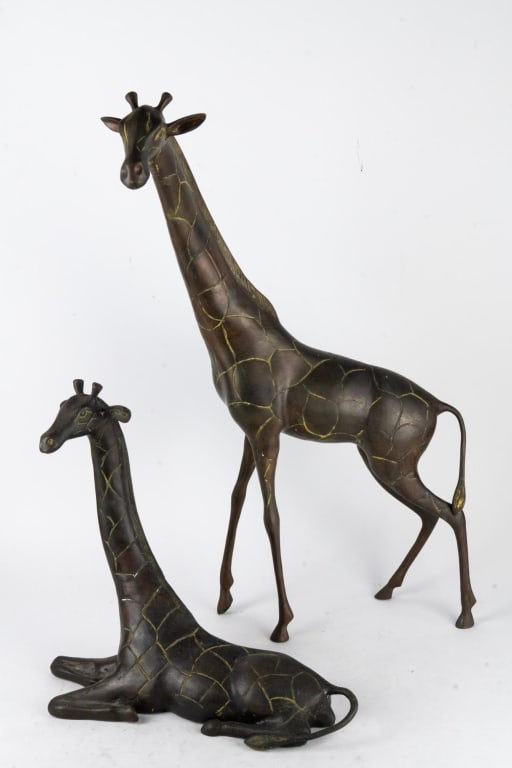 TWO MID-CENTURY METAL GIRRAFE SCULPTURES: Two mid-century metal giraffe sculptures. Note: Each lot in this auction was stored in an active industrial warehouse. Accordingly, lots may exhibit dust and/or surface residue and may benefit from cl