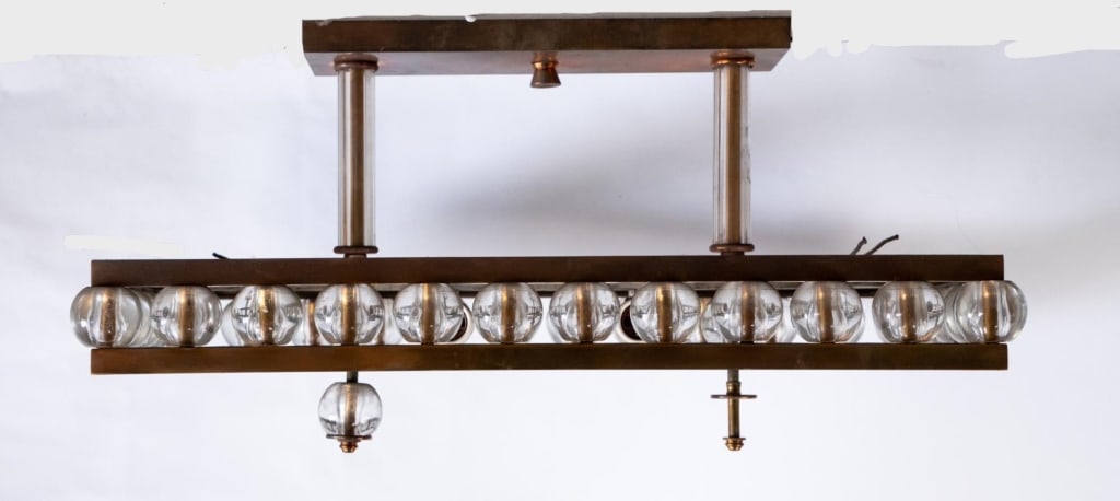 MCM 4 LIGHT CHANDELIER WITH GLASS SPHERES: MCM 4 light chandelier with glass spheres. Note: Each lot in this auction was stored in an active industrial warehouse. Accordingly, lots may exhibit dust and/or surface residue and may benefit from c