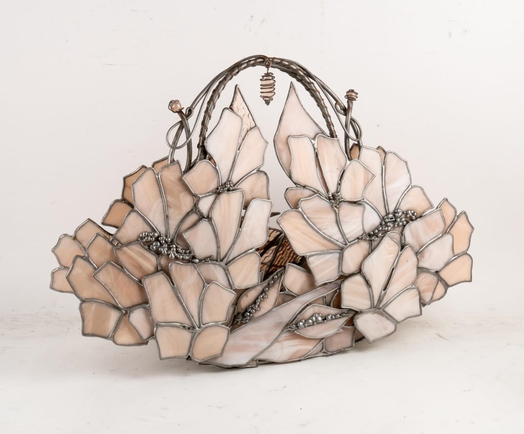 STAINED GLASS AND METAL PURSE FORM ART PIECE: Stained glass and metal purse form art piece. Note: Each lot in this auction was stored in an active industrial warehouse. Accordingly, lots may exhibit dust and/or surface residue and may benefit fro