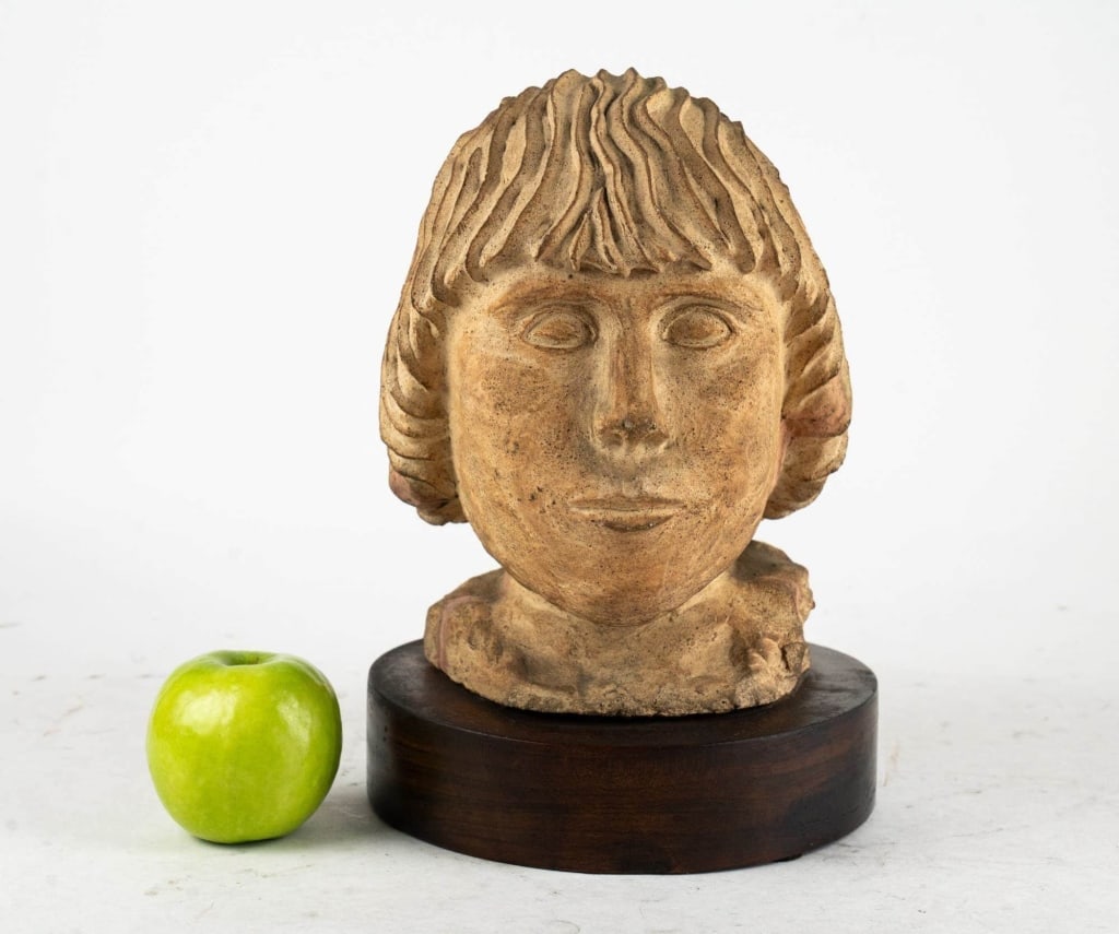 MODERN BUST OF A FEMALE ON A WOODEN BASE: Modern bust of a female on a wooden base. Note: Each lot in this auction was stored in an active industrial warehouse. Accordingly, lots may exhibit dust and/or surface residue and may benefit from cl
