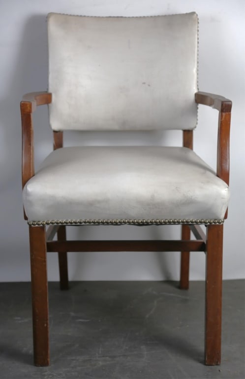 AMERICAN MID CENTURY MAHOGANY LEATHER ARMCHAIR: Mid century mahogany leather chair nail head trim. Note: Each lot in this auction was stored in an active industrial warehouse. Accordingly, lots may exhibit dust and/or surface residue and may benefi