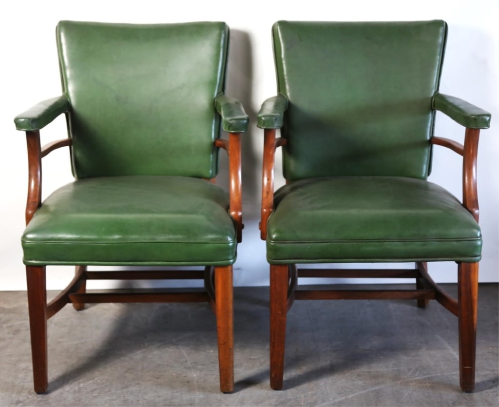 PAIR OF MID-CENTURY MAHOGANY ARM CHAIRS: Pair of mid-century mahogany arm chairs upholstered w/ nail head trim. Note: Each lot in this auction was stored in an active industrial warehouse. Accordingly, lots may exhibit dust and/or surface re